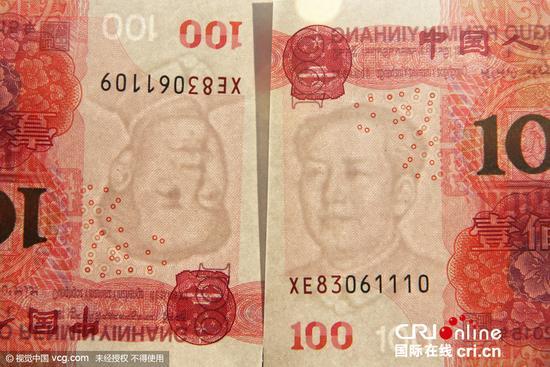 市民取出土豪金百元错币 毛泽东水印没有痣(图)